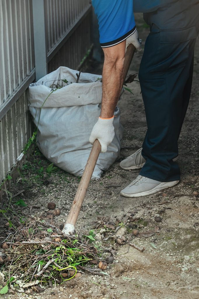 man cleaning the yard